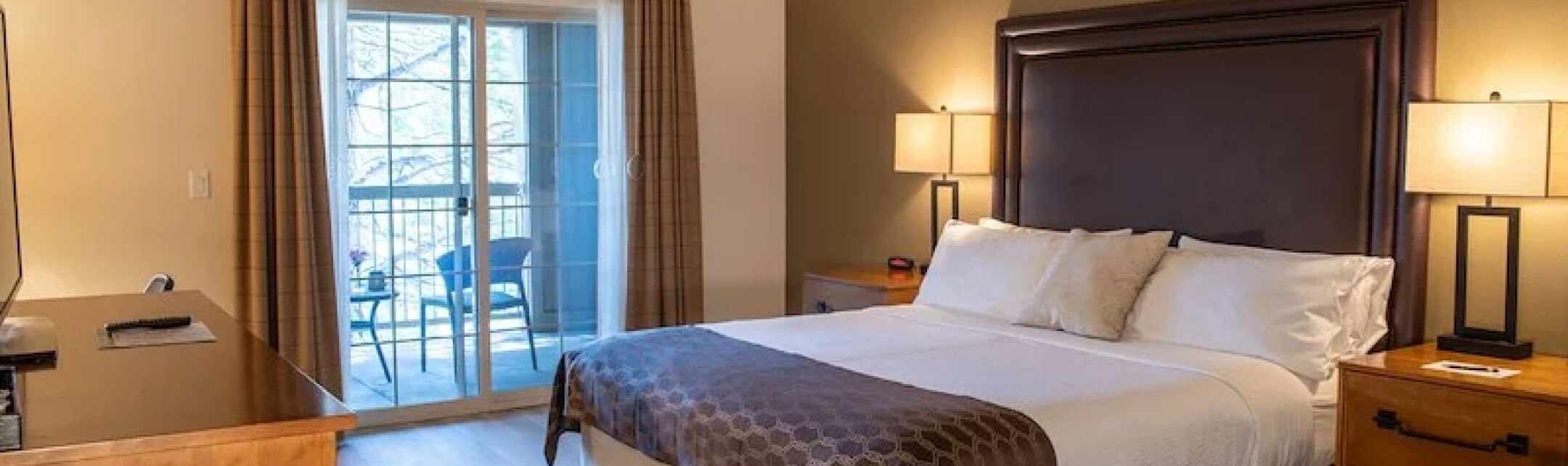 A king-sized bed in a lodge room.