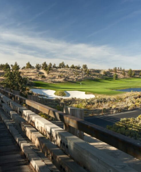 View of the golf course and sand tracks by the putting green.