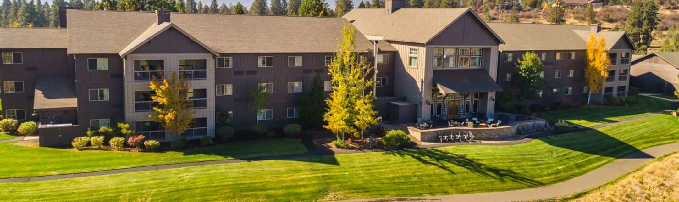 A slightly elevated perspective of a large 3 storey building.