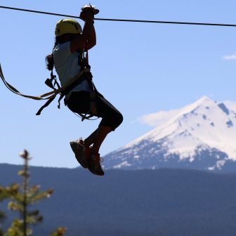 Ziplining at Crater Lake ZIpline with Mt McGloughlin in background